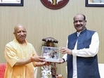 Chief minister Yogi Adityanath felicitates Lok Sabha Speaker Om Birla during a meeting, in Lucknow on Wednesday. ((@myogiadityanath X/ANI Photo))