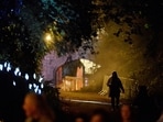 A woman walks on the grounds of Slane Castle during a Halloween festival called 'Puca' celebrating the Celtic tradition of Samhain in Slane, Ireland.