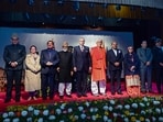 Jammu and Kashmir Chief Minister Omar Abdullah and Lieutenant Governor Manoj Sinha stand for a group photograph along with the newly inducted cabinet ministers and top administration officials on stage following the oath-taking ceremony at the Lok Bhavan Auditorium, in Srinagar on Tuesday. (ANI)