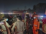 The joint team of Lucknow police, NDRF, SDRF and locals at the spot . (HT)