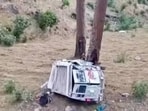 The mangled remains of the cab after it skidded off the road in the Dandal area of Reasi district on Wednesday night. (HT Photo)