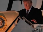 Trump shares photos of damaged golf range, alleges White House staffer was hit by ball.