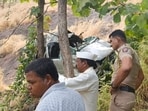 Two people were killed and four others injured after a car travelling from Dimbhe to Bhimashankar plunged nearly 150 to 200 feet into a gorge before turning turtle at Pokhari ghat on Wednesday. (HT)