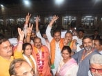 BJP MLC candidates Umesh Dwivedi and Avnish Kumar celebrate in Lucknow.