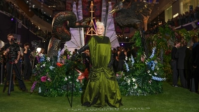Glenn Close, who plays Drusilla Sickle in the upcoming prequel film The Hunger Games: Sunrise on the Reaping, chose a champagne green gown styled with black gloves and diamond earrings.&nbsp; (AP Photo/Scott A Garfitt)