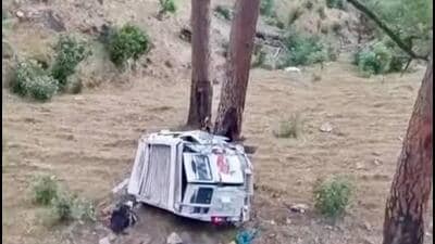 The mangled remains of the cab after it skidded off the road in the Dandal area of Reasi district on Wednesday night. (HT Photo)