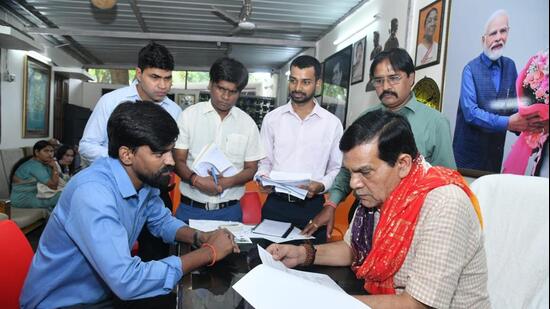 Energy minister AK Sharma during a public grievance hearing at his residence in Lucknow. (Sourced)