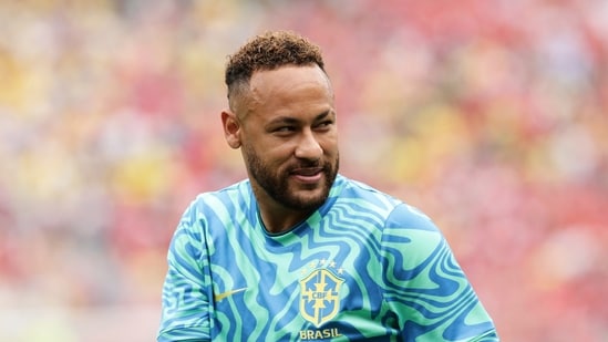 Brazil's Neymar looks on during the warm up ahead the World Cup round of 16 soccer match between Brazil and Norway in East Rutherford, N.J (AP Photo/Adam Hunger)