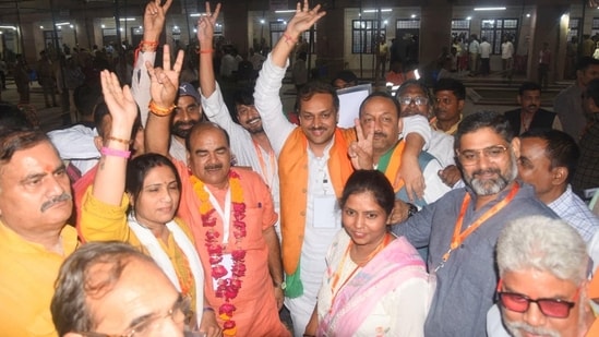 BJP MLC candidates Umesh Dwivedi and Avnish Kumar celebrate in Lucknow. ( Photo by /Hindustan Times)