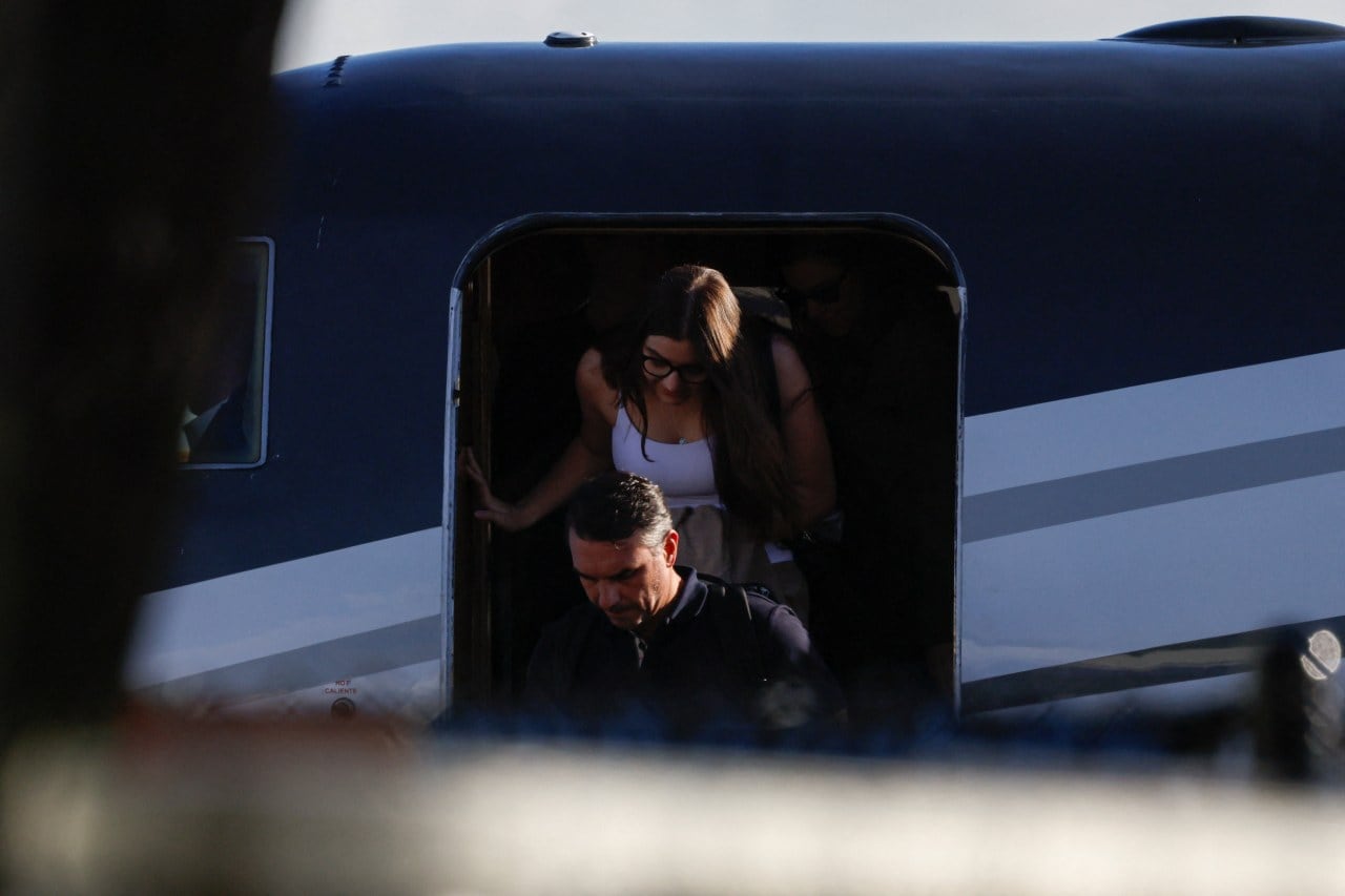 Bolsonaro disembarks from a plane in Miami. Bolsonaro disembarks from a plane in Miami.
