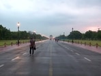 People walk along the Kartavya Path towards India Gate as the Air Quality Index (AQI) is recorded at 93 in the area, categorised as 'satisfactory' by the Central Pollution Control Board (CPCB), in New Delhi on Friday. 