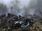Wreckage and smoke seen at the site where a private helicopter operated by Trans Bharat Aviation crashed into a hillside near Chai village in the Joshimath area of Chamoli district, Uttarakhand, Friday, Oct. 30, 2026. 