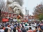CASE IN POINT: The busy Sector-22 mobile market, where fire officials had to spend a considerable time clearing out vehicles parked in front of the affected shop before proceeding with the operations (HT File)