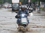 Commuters faced difficulties navigating these roads as accumulated rainwater slowed traffic movement. (HT photo)