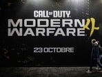 Visitors walks past a Call Of Duty Modern Warfare 4 placard during the preview night of Paris Games Week 2026 in Paris. 