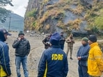 SDRF and other security personnel conduct a search and rescue operation at the site after a helicopter carrying six people on board, including the pilot, crashed into a hillside near Joshimath, about an hour after it took off from Badrinath on its way to Dehradun, in Chamoli district, Uttarakhand, Friday, Oct. 30, 2026.