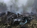 Wreckage and smoke seen at the site where a private helicopter operated by Trans Bharat Aviation crashed into a hillside near Chai village in the Joshimath area of Chamoli district, Uttarakhand, Friday.