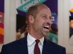 Britain's Prince William laughs during a visit to The Amos Bursary to spotlight the programme's support to the next generation of Black British leaders in London. 