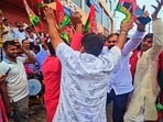 Samajwadi Party workers celebrate the victory in Varanasi. (HT)