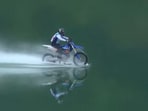 Chinese man completes a record-breaking motorcycle water ride.