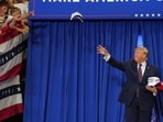 President Donald Trump tosses hats into the crowd at a campaign rally at the Shoemaker Center at Ohio University Chillicothe in Chillicothe, Ohio, Wednesday, Oct. 28, 2026. 