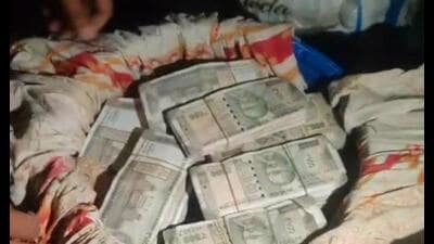 A blue drum with cash recovered from the house in Nawabganj area of Prayagraj. (HT Photo) A blue drum with cash recovered from the house in Nawabganj area of Prayagraj. (HT Photo)