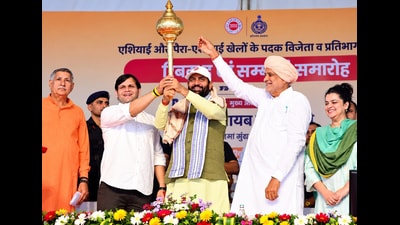 Haryana chief minister Nayab Singh Saini being felicitated with a mace during the cash award distribution ceremony for medal winners and participants of the 2026 Asian and Para-Asian Games in Bhiwani. (Manoj Dhaka/HT) Haryana chief minister Nayab Singh Saini being felicitated with a mace during the cash award distribution ceremony for medal winners and participants of the 2026 Asian and Para-Asian Games in Bhiwani. (Manoj Dhaka/HT)