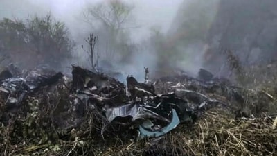 Wreckage and smoke seen at the site where a private helicopter operated by Trans Bharat Aviation crashed into a hillside near Chai village in the Joshimath area of Chamoli district, Uttarakhand, Friday. Wreckage and smoke seen at the site where a private helicopter operated by Trans Bharat Aviation crashed into a hillside near Chai village in the Joshimath area of Chamoli district, Uttarakhand, Friday.