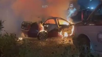 A car on fire at the residence of Narinder Singh Randhawa in Surrey late on Wednesday night. (CCTV Image) A car on fire at the residence of Narinder Singh Randhawa in Surrey late on Wednesday night. (CCTV Image)