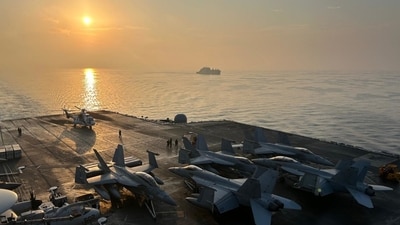 An E/A-18G takes off from the USS George Washington. Eve Hartley/WSJ An E/A-18G takes off from the USS George Washington. Eve Hartley/WSJ