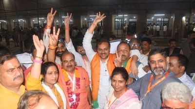BJP MLC candidates Umesh Dwivedi and Avnish Kumar celebrate in Lucknow. ( Photo by /Hindustan Times) BJP MLC candidates Umesh Dwivedi and Avnish Kumar celebrate in Lucknow. ( Photo by /Hindustan Times)