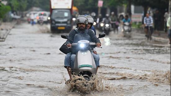Commuters faced difficulties navigating these roads as accumulated rainwater slowed traffic movement. (HT photo)