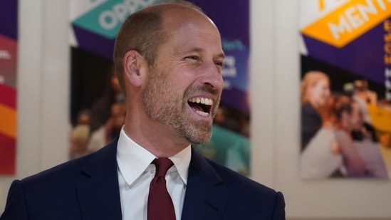 Britain's Prince William laughs during a visit to The Amos Bursary to spotlight the programme's support to the next generation of Black British leaders in London. (via REUTERS)