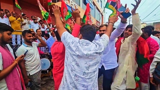 Samajwadi Party workers celebrate the victory in Varanasi. (HT_PRINT)