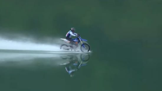 Chinese entrepreneur rides motorcycle across water for 40.74 km, sets Guinness World Record