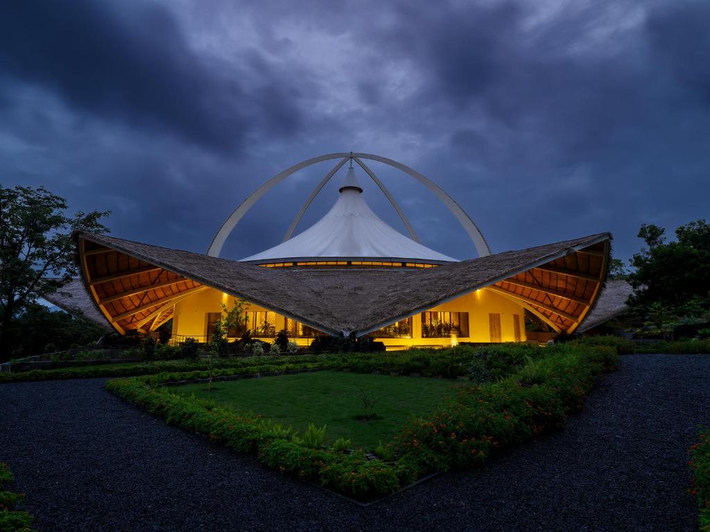Dhyan Vihar features a serene, 72-foot-high meditation hall designed for moments of stillness and reflection.