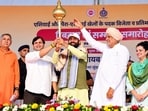 Haryana chief minister Nayab Singh Saini being felicitated with a mace during the cash award distribution ceremony for medal winners and participants of the 2026 Asian and Para-Asian Games in Bhiwani. (Manoj Dhaka/HT)