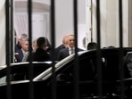 Polish President Karol Nawrocki, who had been flying to Senegal for a state visit and turned the plane around to return to Warsaw, leaves Poland's Constitutional Tribunal.