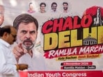 Anti-SIR protest LIVE updates: A man walks near a banner of Lok Sabha LoP Rahul Gandhi ahead of the 