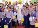 Punjab power minister Tarunpreet Singh Sond with students during the inauguration event at Khanna Government School on Friday. (HT)