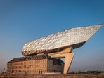 Residents say the extension to Antwerp’s port house, likened by its architects to a “diamond bow”, contrasts brutally with the low-rise brick-and-stone structures of the neighbourhood. (Adobestock)