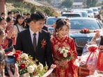 Strangers bring gifts to Chinese man's wedding.