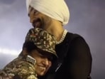 Diljit Dosanjh gave a hug to a female CRPF officer on stage.