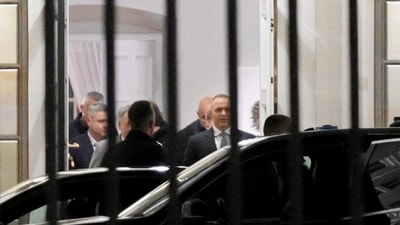 Polish President Karol Nawrocki, who had been flying to Senegal for a state visit and turned the plane around to return to Warsaw, leaves Poland's Constitutional Tribunal. (Reuters)