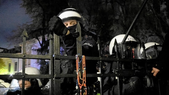 Police stand guard during a protest outside the premises of Poland's Constitutional Tribunal after the tribunal said on its website that the tribunal's president Bogdan Swieczkowski, who was a deputy justice minister under the Law and Justice (PiS) government, had been suspended on Friday, in Warsaw, Poland, October 30, 2026. Agencja Wyborcza.pl/via REUTERS ATTENTION EDITORS - THIS IMAGE WAS PROVIDED BY A THIRD PARTY. POLAND OUT. NO COMMERCIAL OR EDITORIAL SALES IN POLAND.(Agencja Wyborcza.pl via REUTERS)