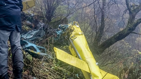 Wreckage of a private helicopter operated by Trans Bharat Aviation lying on a hillside near Chai village in the Joshimath area of Chamoli district, Uttarakhand. (PTI)