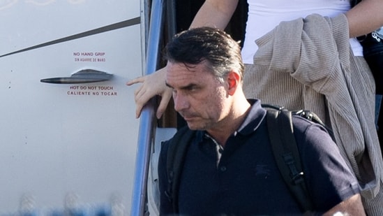 In his last statement from the country before he fled to the US, Bolsonaro confirmed that he had been ordered to turn in his passports. (AFP)
